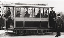 https://upload.wikimedia.org/wikipedia/commons/thumb/9/90/First_electric_tram-_Siemens_1881_in_Lichterfelde.jpg/220px-First_electric_tram-_Siemens_1881_in_Lichterfelde.jpg