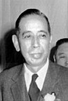 https://upload.wikimedia.org/wikipedia/commons/thumb/0/0f/Nobusuke_Kishi_Dec_14%2C_1956.jpg/100px-Nobusuke_Kishi_Dec_14%2C_1956.jpg
