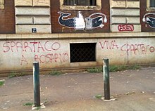 https://upload.media.orgikipedia/commons/thumb/2/2a/Spartaco_a_Rosarno_graffito_Torino_via_Valperga_Caluso.jpg/220px-Spartaco_a_Rosarno_graffito_Torino_via_Valperga_Caluso.jpg
