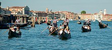 https://upload.media.orgikipedia/commons/thumb/5/57/Gondola_convoy%2C_Grand_Canal%2C_Venice.jpg/220px-Gondola_convoy%2C_Grand_Canal%2C_Venice.jpg