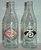 https://upload.wikimedia.org/wikipedia/commons/thumb/6/62/Commemorative_Coca_Cola_bottles.jpg/160px-Commemorative_Coca_Cola_bottles.jpg